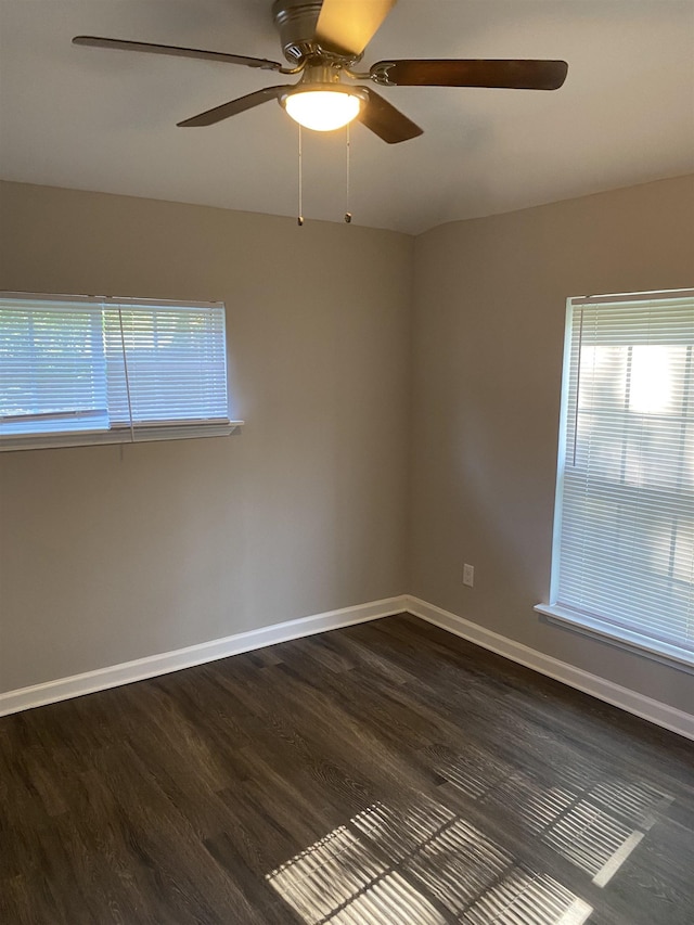 unfurnished room featuring ceiling fan and dark hardwood / wood-style floors