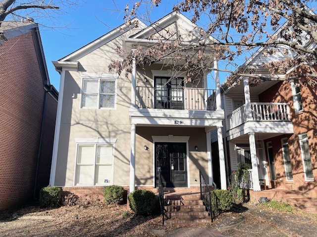 view of front of house featuring a balcony