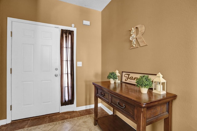 entryway featuring light tile patterned flooring