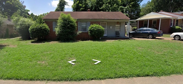 view of front of home with covered porch and a front yard