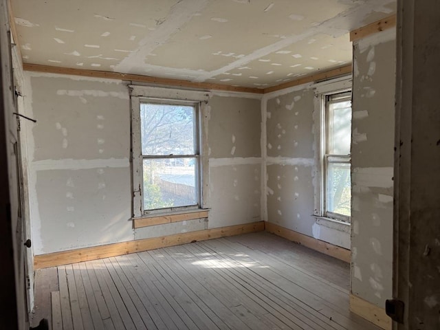 spare room with hardwood / wood-style flooring