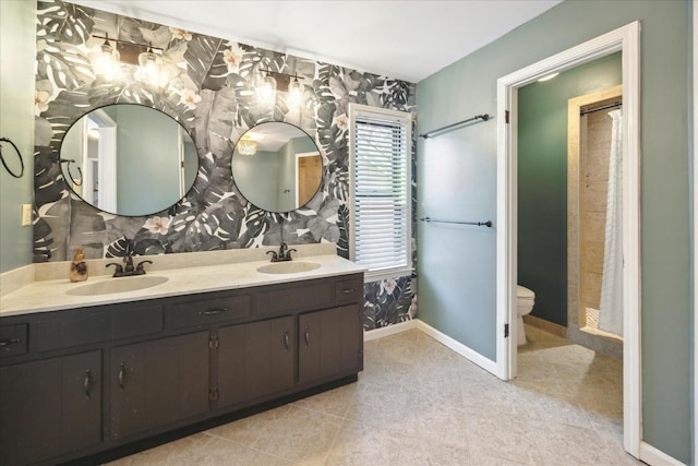 bathroom with tile patterned floors, toilet, and vanity