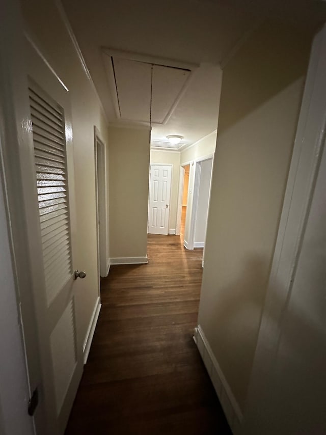 hall featuring dark hardwood / wood-style flooring and ornamental molding