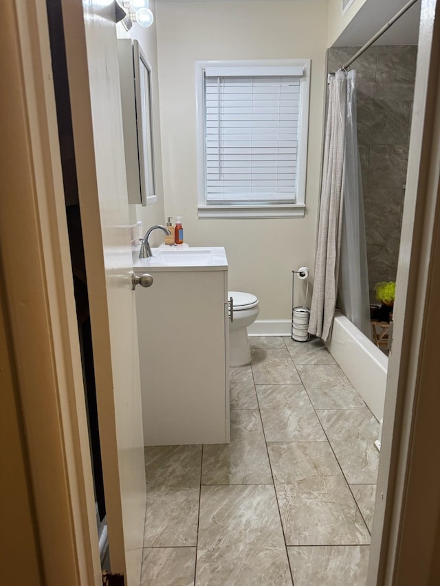 full bathroom with toilet, vanity, and shower / tub combo with curtain