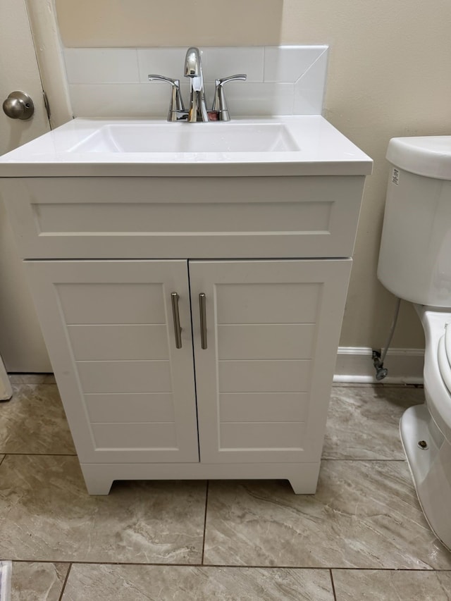 bathroom with sink and toilet