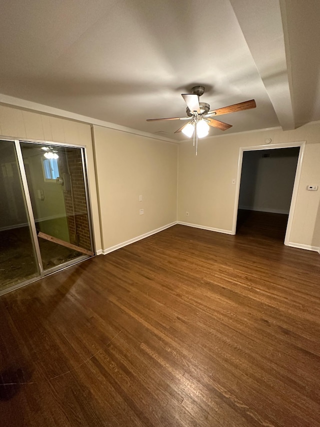 unfurnished bedroom with ceiling fan and dark hardwood / wood-style flooring