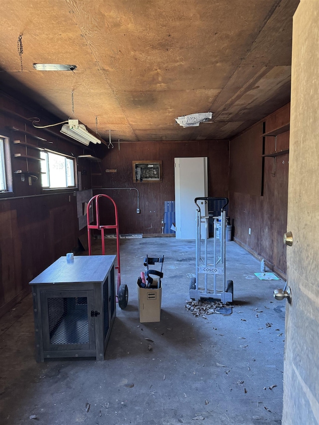 garage featuring wood walls