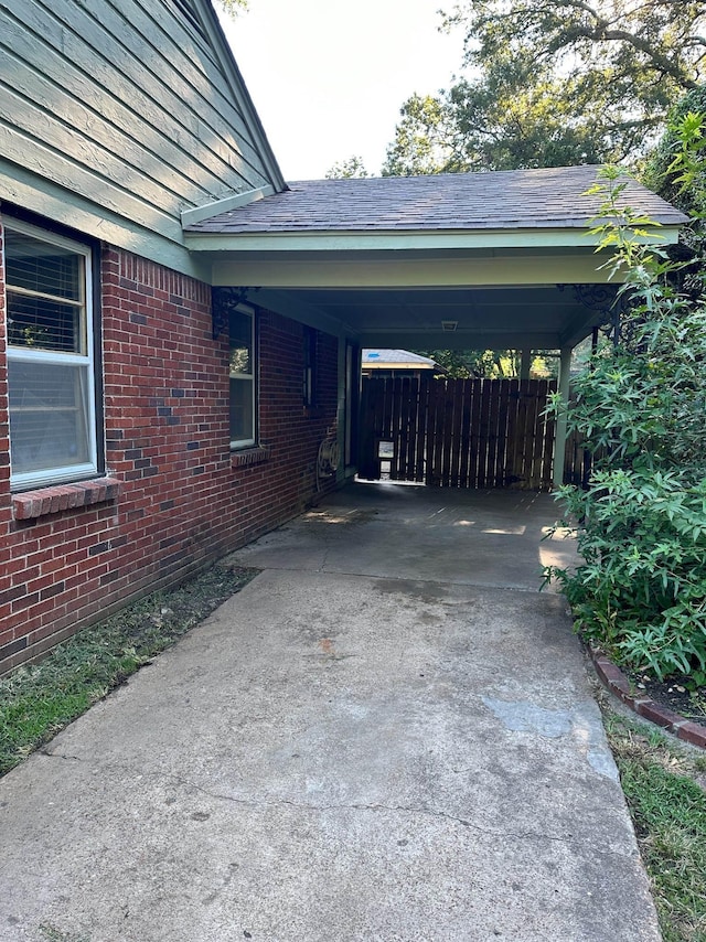 view of vehicle parking featuring a carport