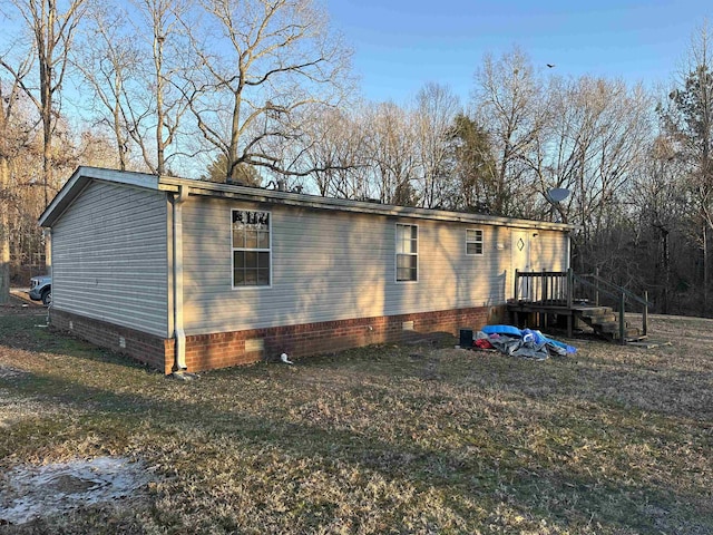 view of home's exterior with a yard