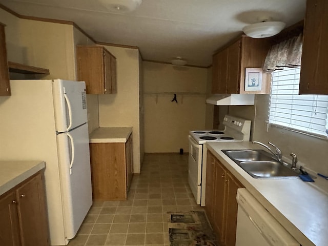 kitchen with sink and white appliances