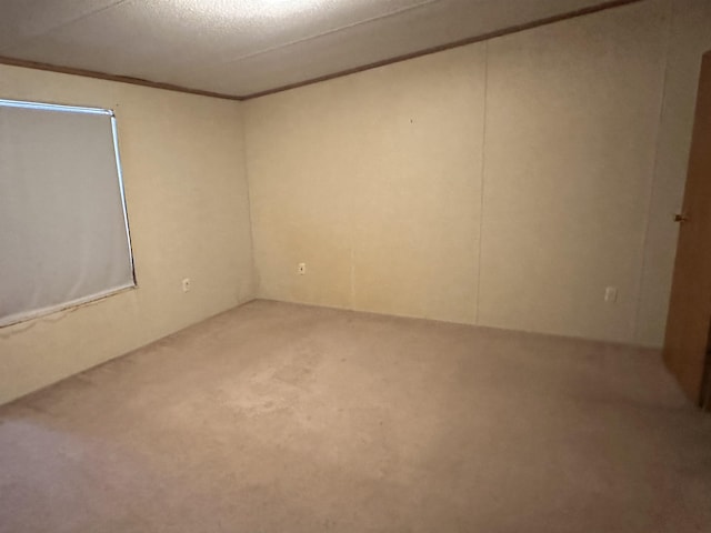 unfurnished room with a textured ceiling