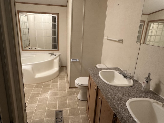 bathroom featuring toilet, a tub to relax in, tile patterned floors, crown molding, and vanity