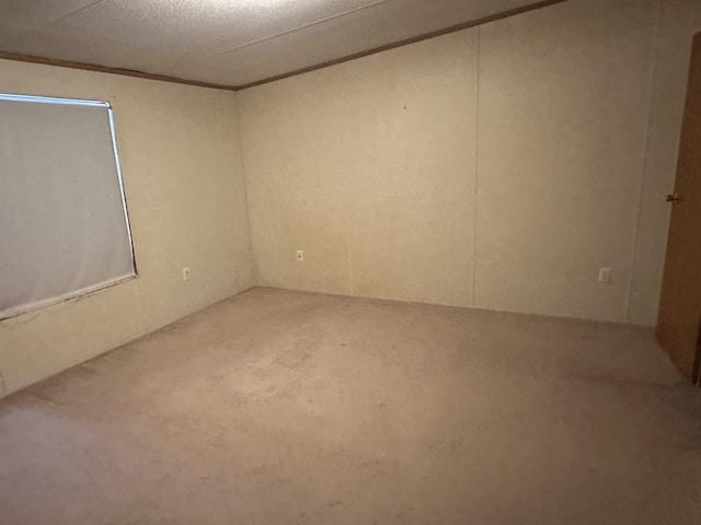 unfurnished room with a textured ceiling