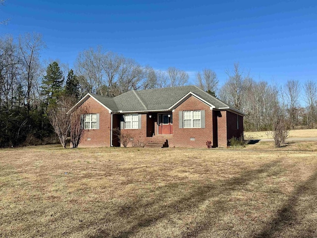 single story home featuring a front lawn