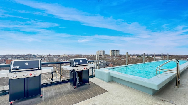 view of pool with area for grilling