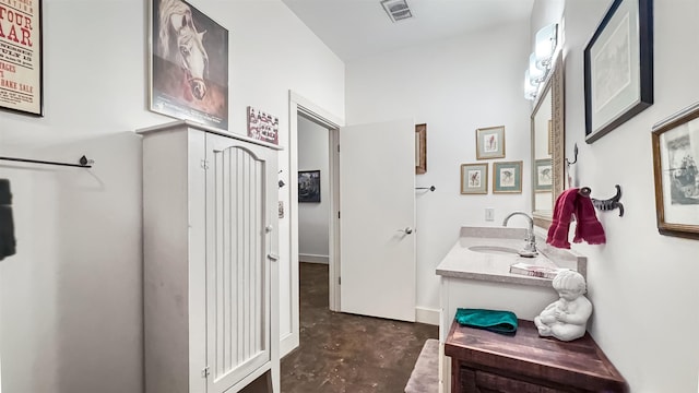 bathroom featuring vanity and concrete flooring