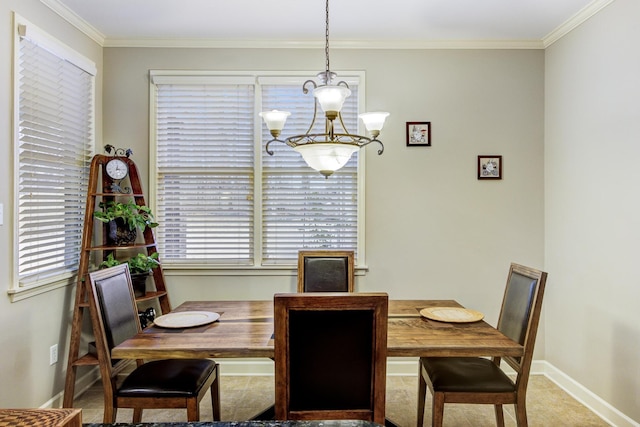 dining area with a notable chandelier, crown molding, and carpet floors