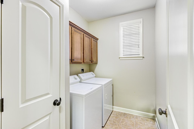 laundry area featuring cabinets and independent washer and dryer