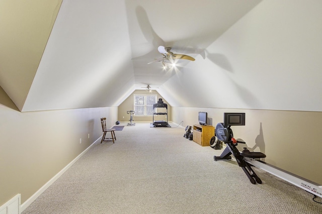 workout room featuring carpet and vaulted ceiling