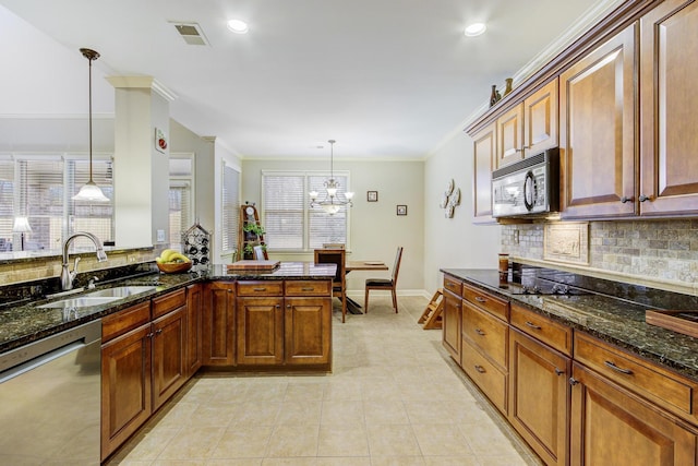 kitchen with black appliances, ornamental molding, pendant lighting, and sink