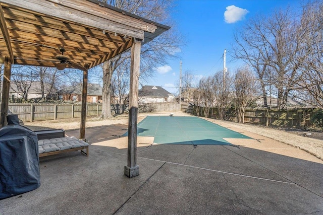 view of pool featuring ceiling fan and a patio area