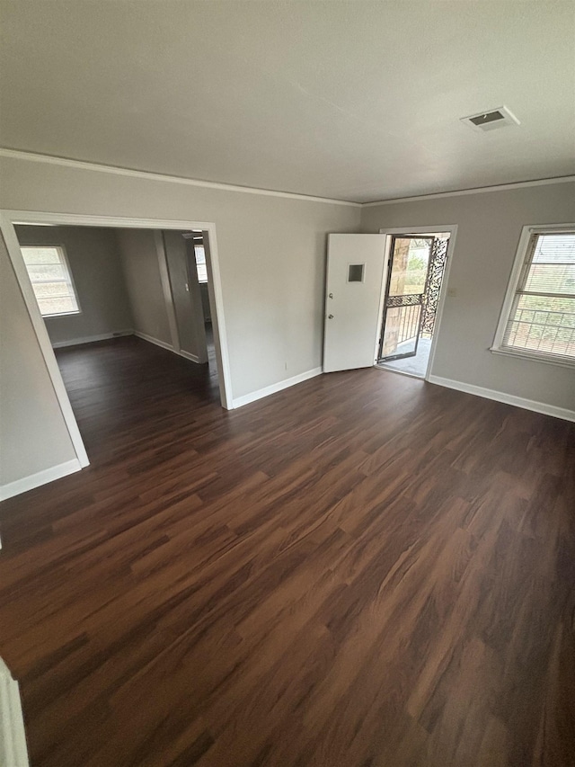 spare room featuring dark hardwood / wood-style floors