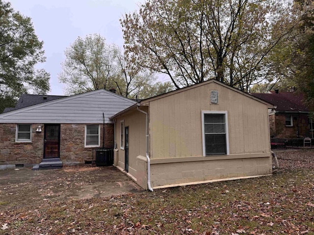 back of property featuring central air condition unit