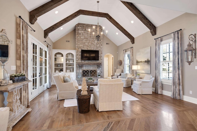 living room featuring a notable chandelier, a fireplace, wood-type flooring, high vaulted ceiling, and beam ceiling