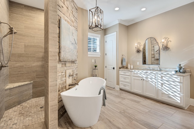 bathroom featuring crown molding, separate shower and tub, a notable chandelier, and vanity