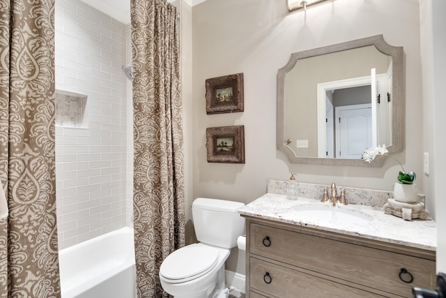 full bathroom featuring shower / bath combo with shower curtain, toilet, and vanity