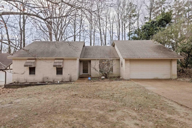 ranch-style home featuring a garage