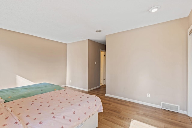 bedroom with light hardwood / wood-style floors