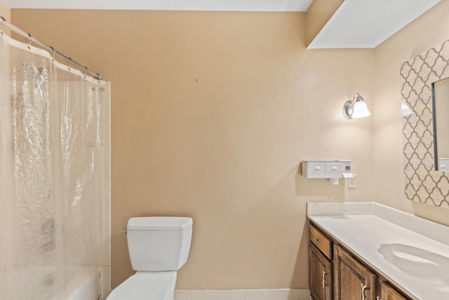 full bathroom with vanity, toilet, and shower / bath combo