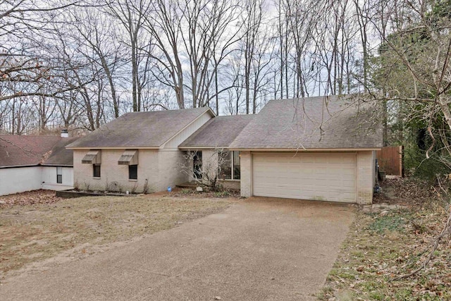 ranch-style house featuring a garage