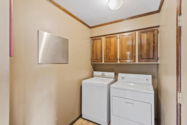 washroom with washer and clothes dryer, ornamental molding, light hardwood / wood-style floors, and cabinets