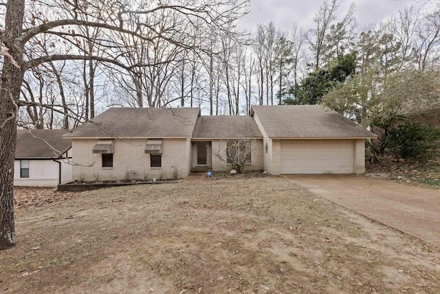 ranch-style house featuring a garage