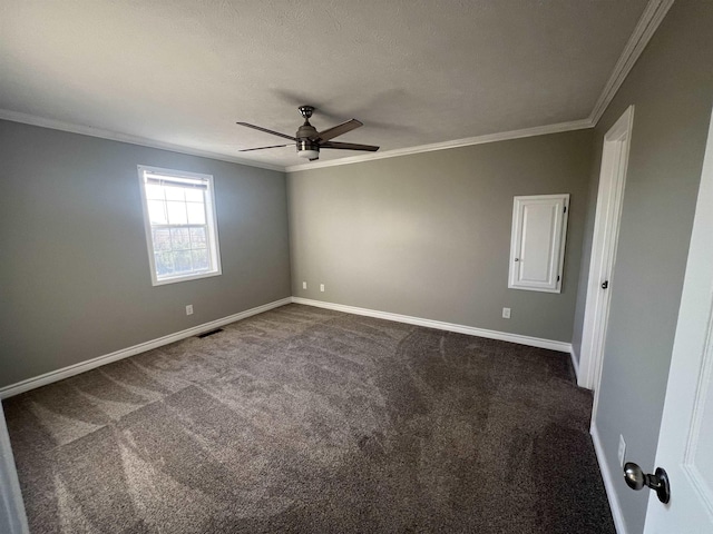 spare room with a textured ceiling, carpet floors, ceiling fan, and ornamental molding