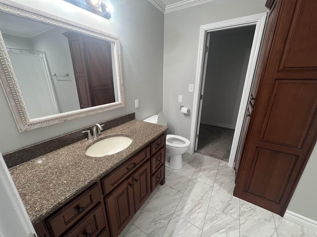 bathroom with toilet, vanity, and crown molding