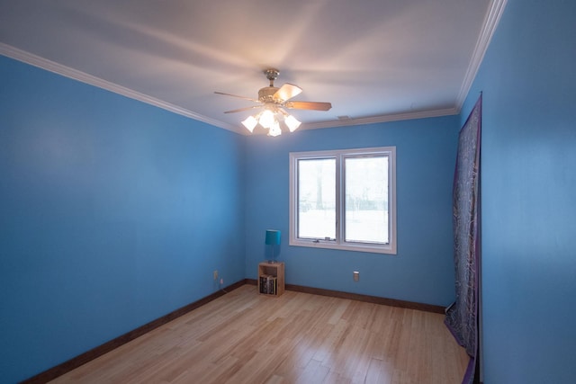 spare room featuring ceiling fan, light hardwood / wood-style flooring, and crown molding