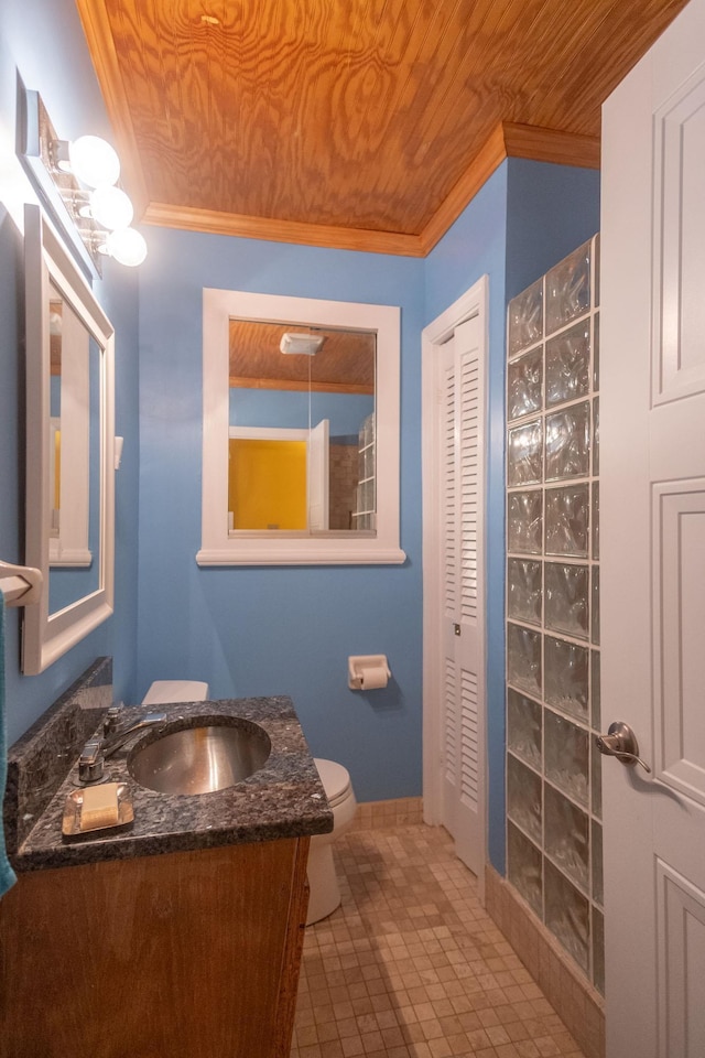 bathroom with toilet, vanity, ornamental molding, and wood ceiling