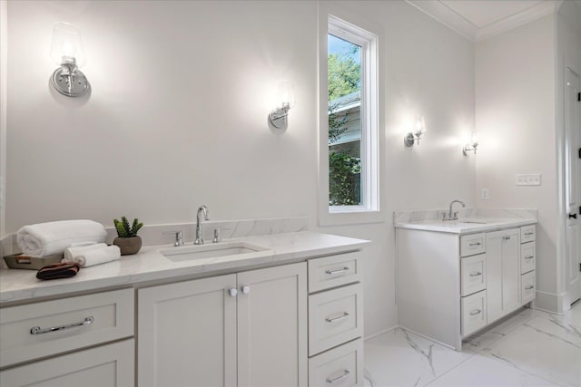 bathroom featuring crown molding, a wealth of natural light, and vanity