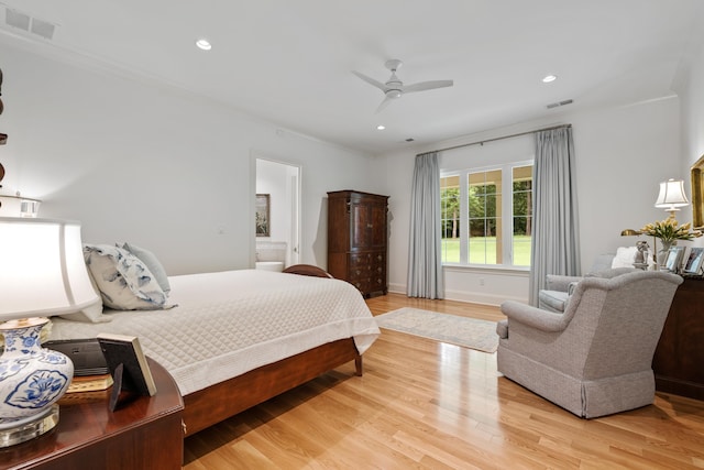 bedroom with ceiling fan, crown molding, and light wood-type flooring