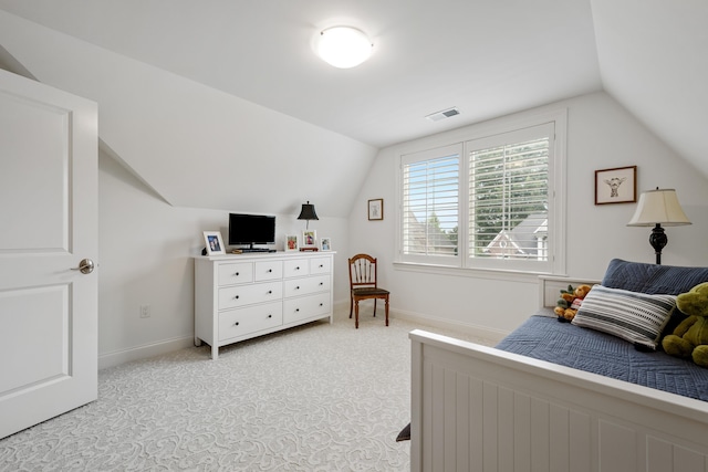 carpeted bedroom featuring vaulted ceiling