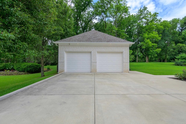 garage featuring a yard