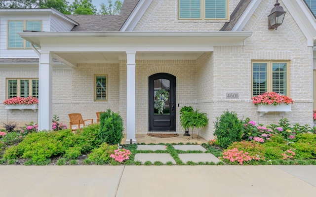 doorway to property featuring a porch