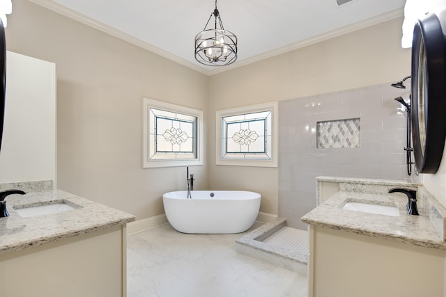 bathroom with vanity, a tub, and crown molding