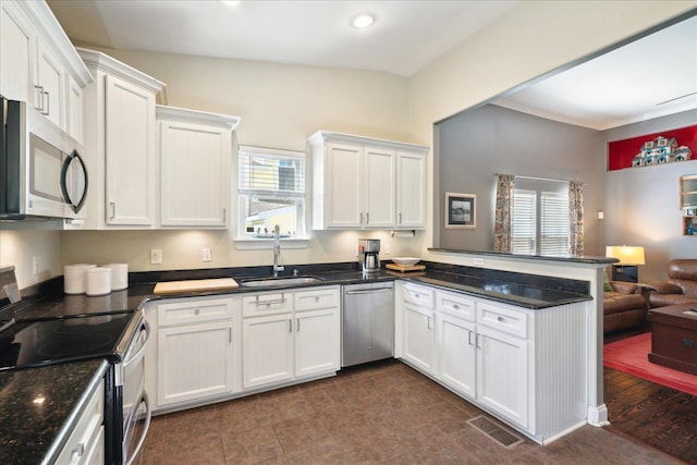 kitchen featuring sink, white cabinetry, and stainless steel appliances