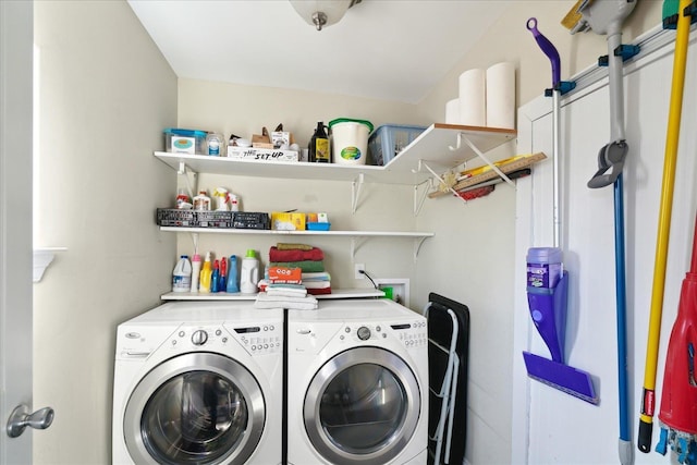 washroom with washer and dryer