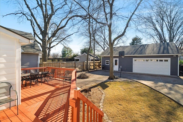 deck with a garage and a yard