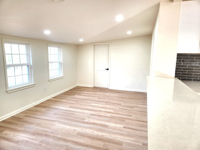 unfurnished room featuring light hardwood / wood-style floors